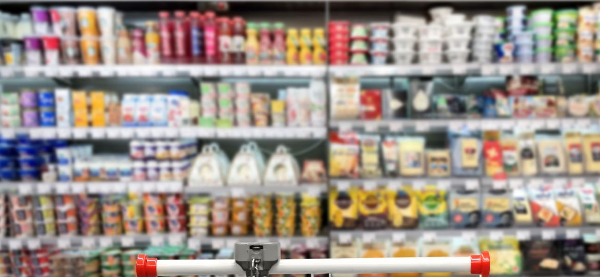 choosing-dairy-products-supermarket-empty-grocery-cart-empty-supermarket