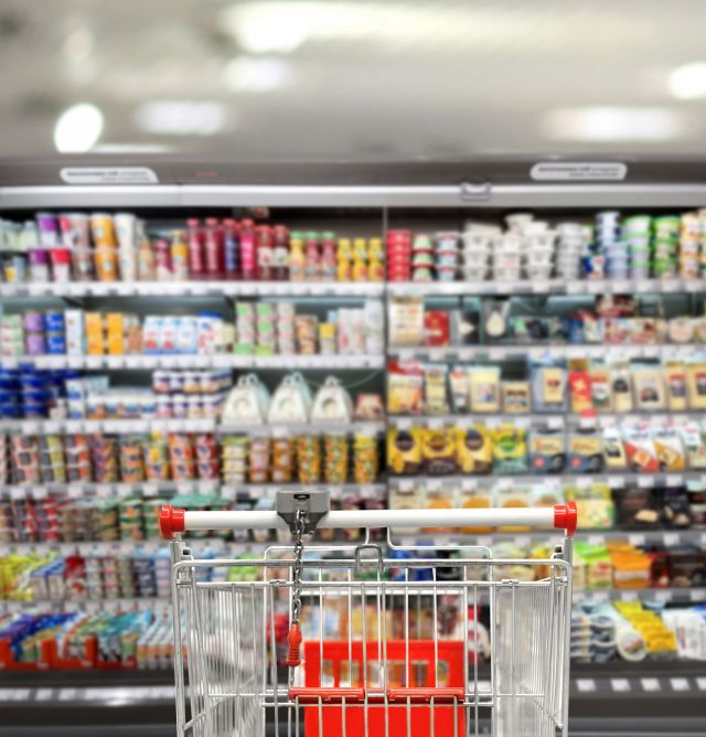 choosing-dairy-products-supermarket-empty-grocery-cart-empty-supermarket